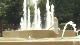 Blonde made to bath in public fountain